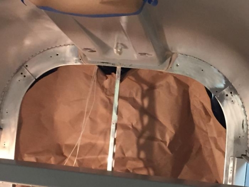 Overhead console epoxied to aft bulkhead