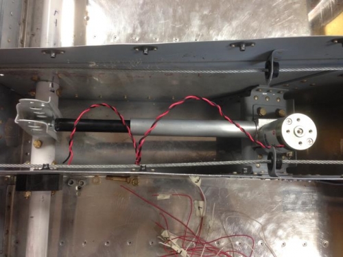 Flap motor to actuating arm