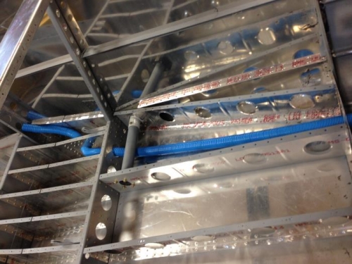 Conduit routed through ribs