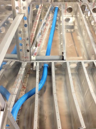 Conduit routed through ribs