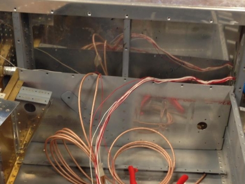 Pulled conduit and pull wires under baggage floor to back seat