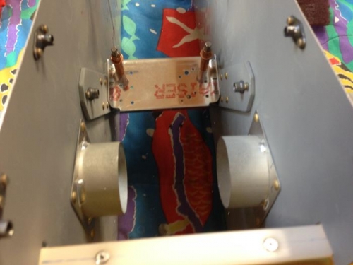 Flap actuator bracket between inboard seat rib subassemblies