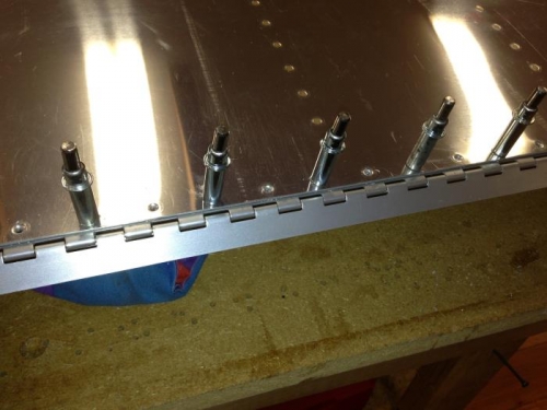 Hinge clecoed onto elevator