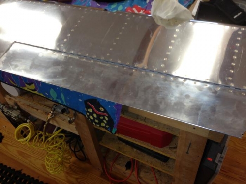 Trim tab onto elevator