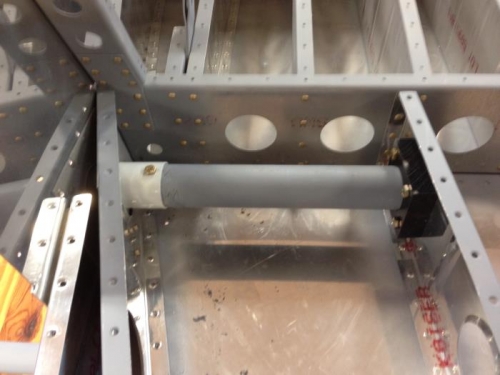 Inside attachment of step below baggage floor