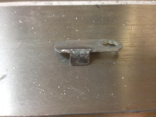 Tab welded on tang of lock