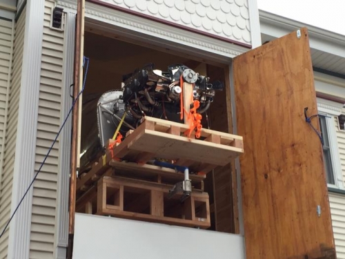 Plane exiting garage on pallet