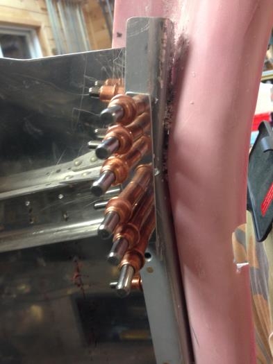 Gussets clecoed to fwd side channel