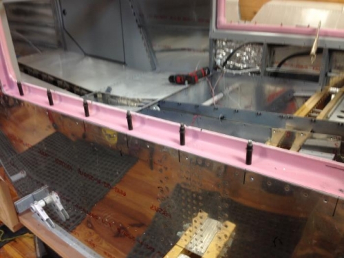 Door frame drilled and clecoed to cabin sill.