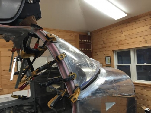 Clamps holding windscreen in place