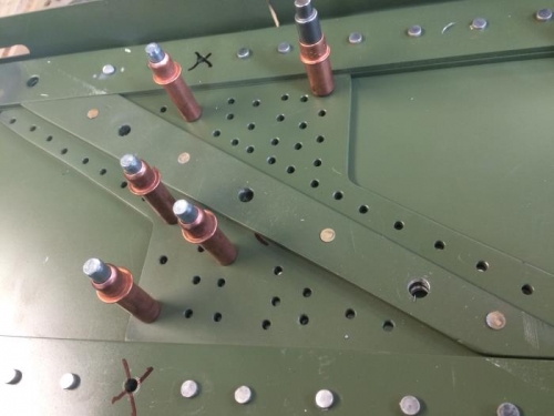 Spar splice plate with flush rivets holding the filler plate in place.
