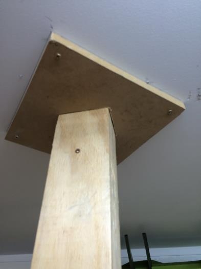 Top of vertical post bolted to ceiling with MDF frame to kep it solid.