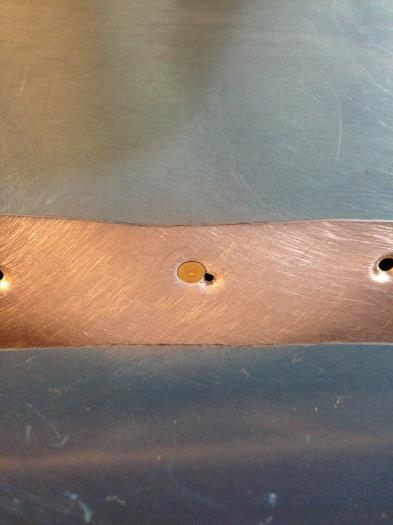 After moving the dimple and riveting.