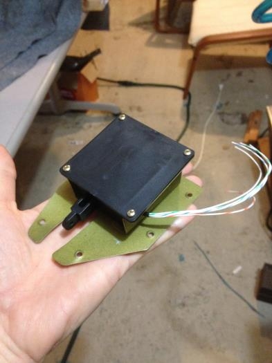 Servo mounted on the inspection plate.