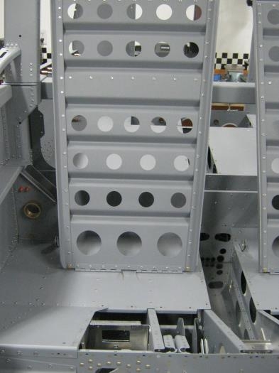 Front view seats attached to flooring using hinge pins