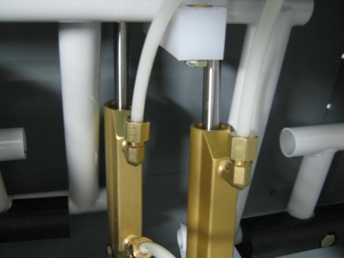 Reservoir brake lines to fittings on right rudder pedal master cylinders