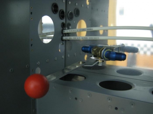 Installed fuel valve shutoff mechanism in forward fuselage