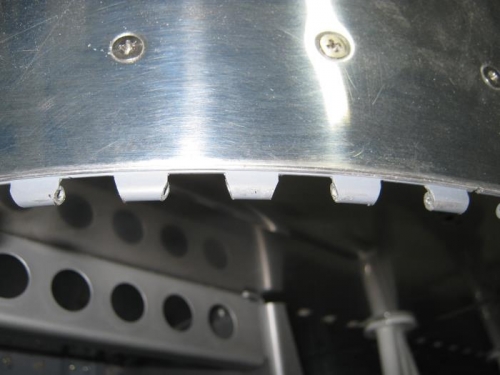 Beveled upper cowling hinge at the corners.