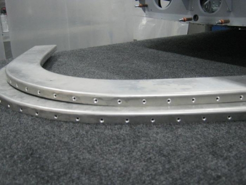 Machine countersunk holes on outside flanges of rollbar front