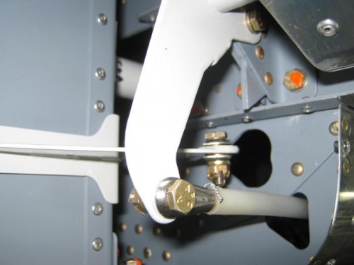 Lower aft stabilator cable attached to stabilator horn