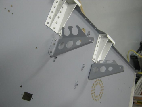 Riveted F00027 comm supports to panel base