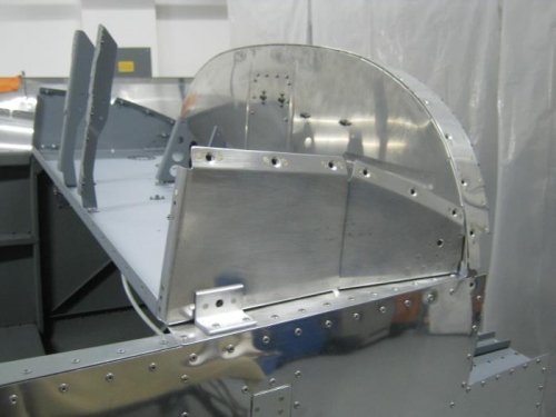 Riveted canopy rib assemblies to panel base