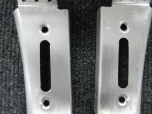 Dimpled holes in support frames for the head of a #8 screw