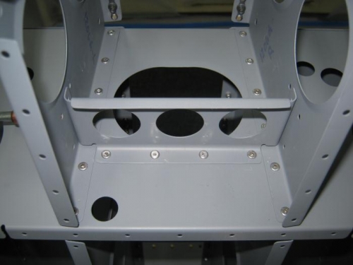 Rivet the F1207 bearing bracket brace to the F1206a bulkhead