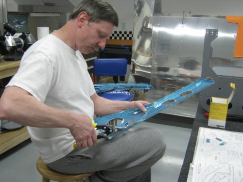 Removed the vertical strip of material from lightning holes of each F1215 seat rib