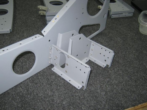 Instll pulley bracket assembly on F1215 rib