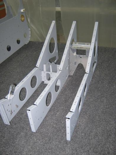 Install crotch strap brackets to flaperon mixer bracket seat rib assermbly