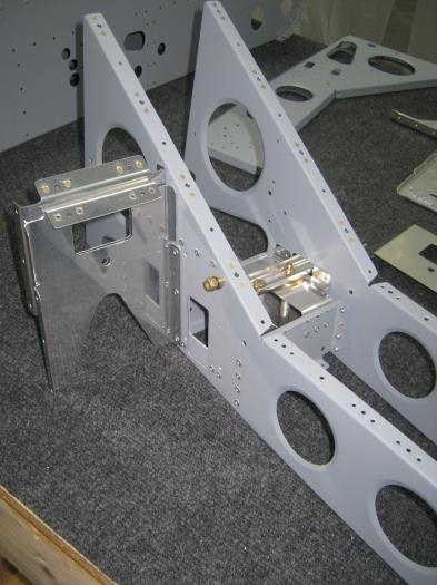 Install crotch strap brackets to pulley bracket assembly