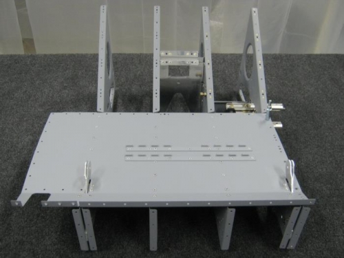 Rivet the F1225-L seat floor to the remaining seat rib assy and flaperon mixer bracket/seat assy