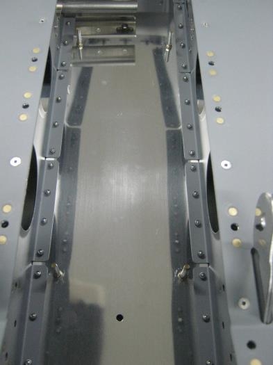 Installed 6 system block studs in the holes of the F1276 bottom skin