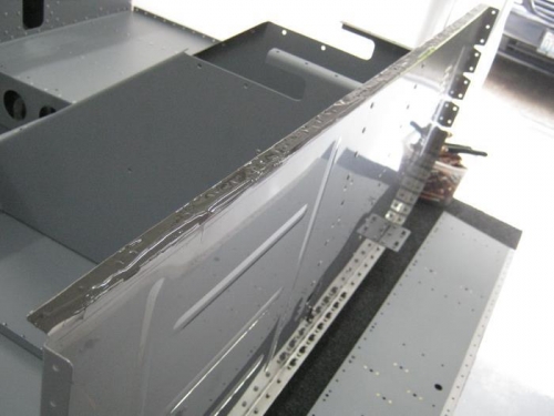 Applied ProSeal to the top flange of the firewall under the F1201B firewall shelf