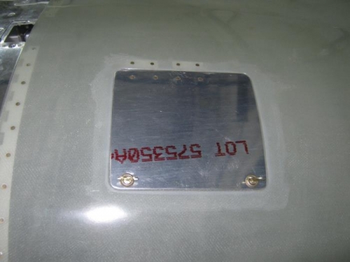 Oil door fit and attachment hinge riveted in place