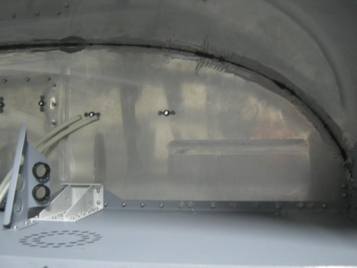 Sealant applied.  View from aft firewall; right side