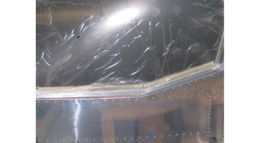 Placed masking tape over the edges of forward and aft attach angles of the canopy frame