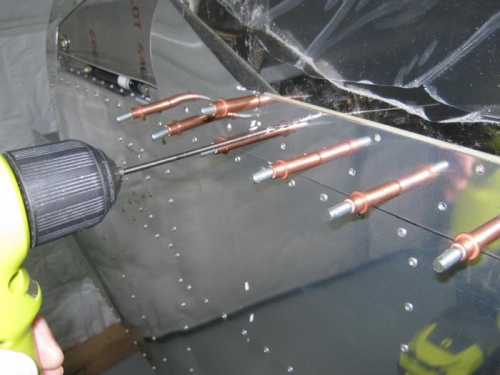 Match drilling screw attachment holes into canopy