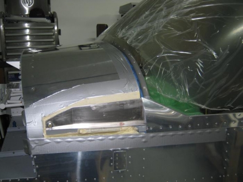 Layed up duct tape and packing tape over layup area and applied release wax