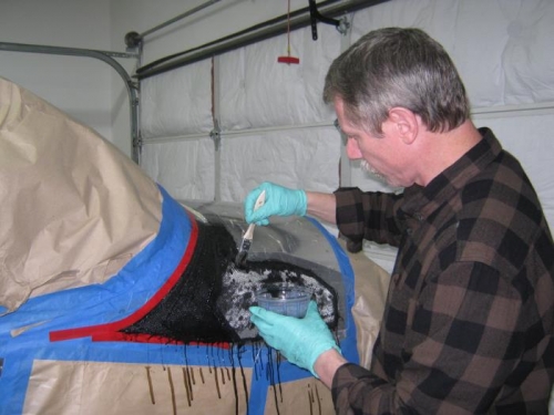Applying the 2nd layer of fiberglass.