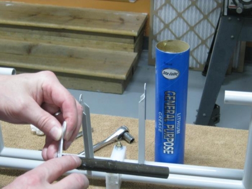 Greased brake pedal torque tubes prior to assembly