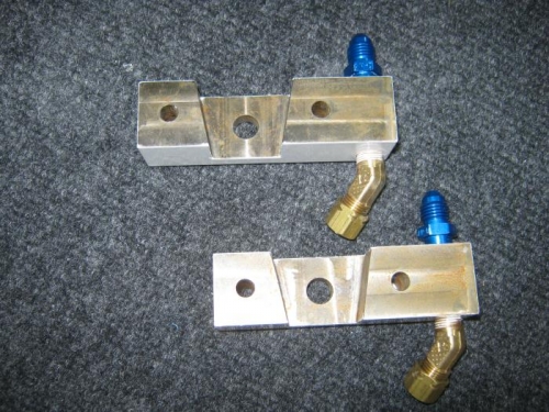 Gear attach bracket fittings assembled; fluid fittings installed