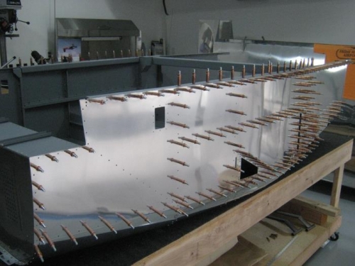 Assembling left fuselage side skins