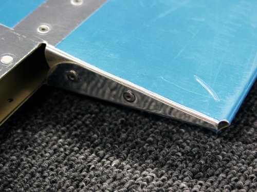 Trim Tab Cutout Bending/Riveting