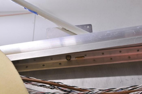 Tongue Extends Through Slider, Rail, and Angle