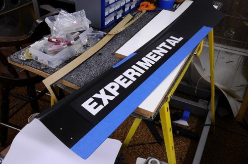 Blue Tape Marks Bottom Edge Of Label