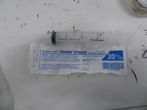 Miniature caulking gun. 20 cc syringe bought at the drug mart