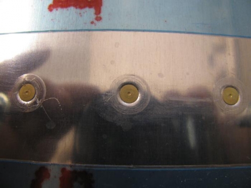Not being set yet, the third rivet (on right) is showing evidence of misalingment