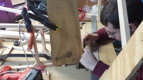 Michael working on getting the 7deg on the tail post